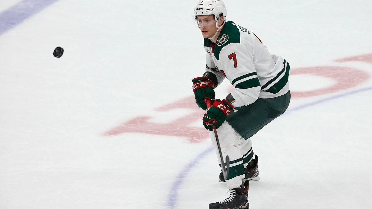 Minnesota Wild forward Nico Sturm (7) looks at the puck against Anaheim Ducks during the third period of an NHL hockey game Saturday, Feb. 20, 2021, in Anaheim, Calif. The Minnesota Wild won 5-1. (AP Photo/Ringo H.W. Chiu)