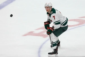 Minnesota Wild forward Nico Sturm (7) looks at the puck against Anaheim Ducks during the third period of an NHL hockey game Saturday, Feb. 20, 2021, in Anaheim, Calif. The Minnesota Wild won 5-1. (AP Photo/Ringo H.W. Chiu)