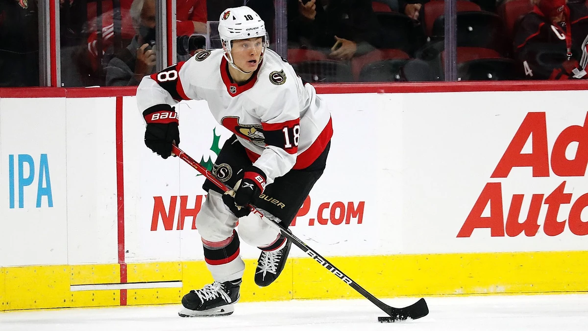 Ottawa Senators' Tim Stützle (18) moves the puck against the Carolina Hurricanes during the second period of an NHL hockey game in Raleigh, N.C., Thursday, Dec. 2, 2021. (AP Photo/Karl B DeBlaker)
