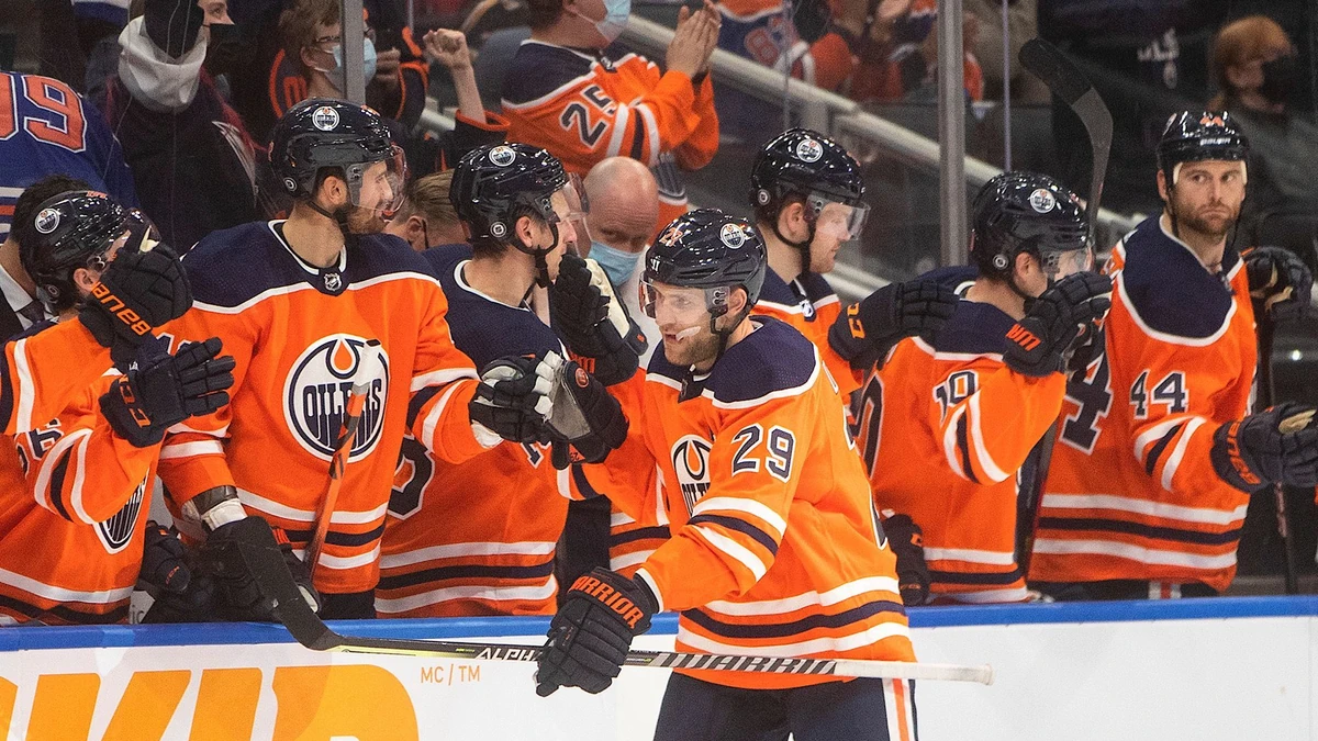 Edmonton Oilers Leon Draisaitl (29), celebrates his goal against the Calgary Flames during third-period preseason NHL hockey game action in Edmonton, Alberta, Monday, Oct. 4, 2021. (Jason Franson/The Canadian Press via AP)