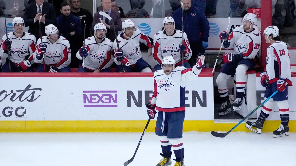 Washington Capitals' Alex Ovechkin acknowledges the crowd's applause after scoring his 800th career goal, on a hat trick against the Chicago Blackhawks during the third period of an NHL hockey game Tuesday, Dec. 13, 2022, in Chicago. (AP Photo/Charles Rex Arbogast)