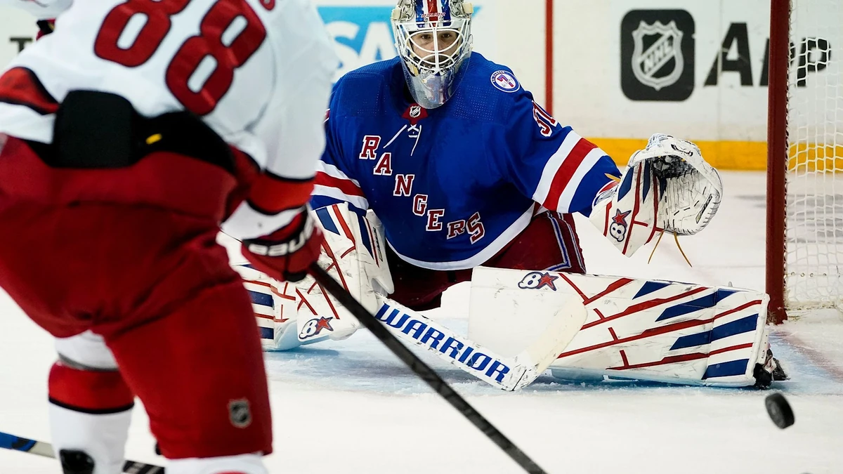 New York Rangers goaltender Igor Shesterkin (31) makes a save against Carolina Hurricanes center Martin Necas (88) in the third period of Game 4 of an NHL hockey Stanley Cup second-round playoff series, Tuesday, May 24, 2022, in New York. The Rangers won 4-1. (AP Photo/John Minchillo)