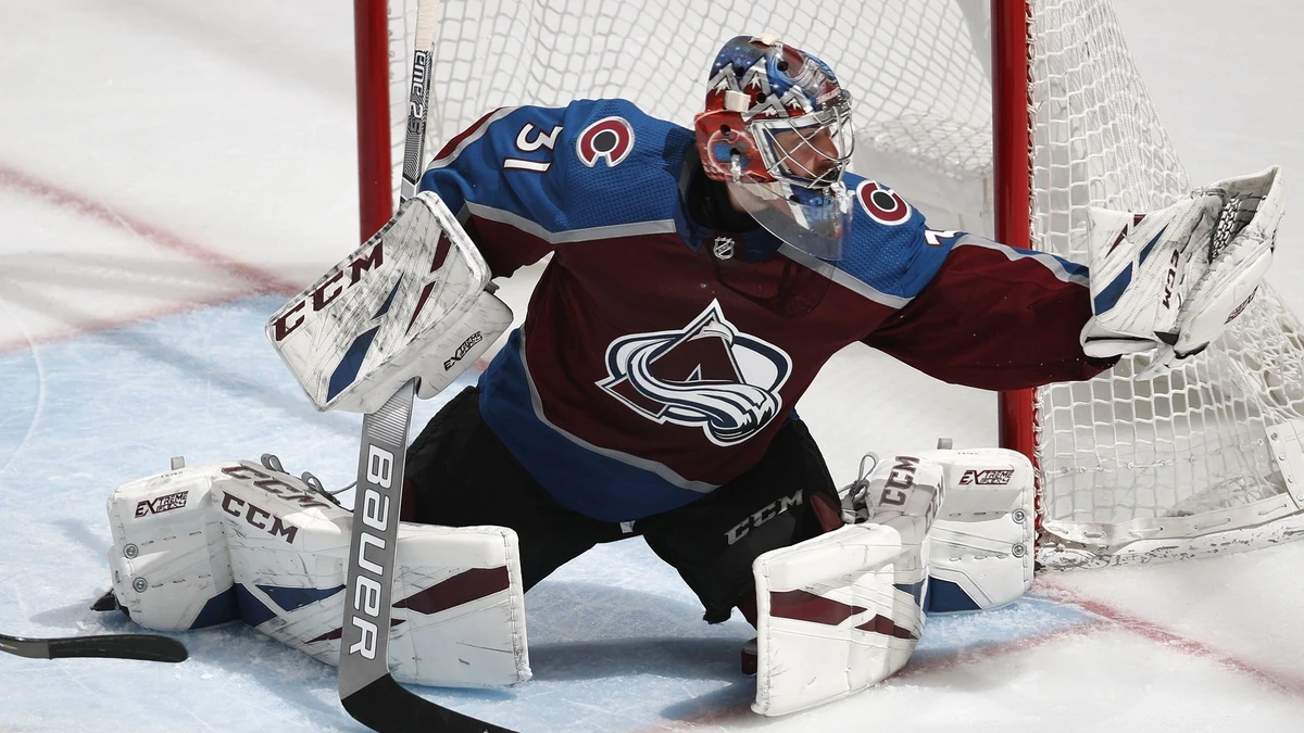 Colorado Avalanche goaltender Philipp Grubauer makes a glove save of a Vegas Golden Knights shot during the third period of an NHL hockey game Wednesday, March 27, 2019, in Denver. The Avalanche won 4-3. (AP Photo/David Zalubowski) |