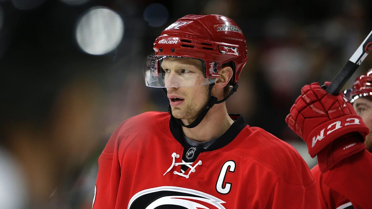 Carolina Hurricanes' Eric Staal (12) waits to go into the game during the first period of an NHL hockey game against the Boston Bruins in Raleigh, N.C., Friday, Feb. 26, 2016. (AP Photo/Gerry Broome)