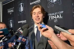 FILE - Macklin Celebrini, the expected No. 1 pick in the NHL draft to the San Jose Sharks, speaks with reporters prior to Game 2 of the Stanley Cup Final at Amerant Bank Arena in Sunrise, Florida, Monday, June 10, 2024. Celebrini sets aside his NBA ties by looking ahead to a hockey career, entering the NHL draft as the presumptive No. 1 pick on Friday, June 28. (AP Photo/Stephen Whyno, File)